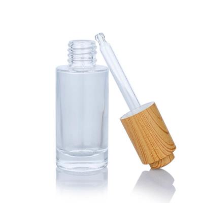 China 30ml Transparent Rectangle Frosted Glass Bottle With Bamboo Lid For Empty Dropper Bottle for sale