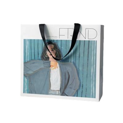 China Recycled Materials Recyclable Custom Printed Luxury Boutique Clothes Retail Paper Packaging Bags Shopping Art Paper Bags for sale