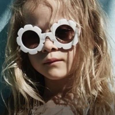 China Concave shape cute anti-UV sunglasses new fashion personality wild baby sun glasses flower children's sunglasses and women for sale