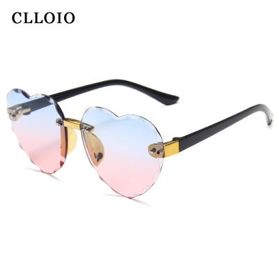 China Fashion Sunglasses Fashion Kids Love Rimless Sunglasses Girls Shading Heart Sunglasses For Kids for sale