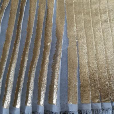 China 100% Polyester Anti-Static All Over Foil Print Chiffon Fabric Metallic Pleated Polyester Gold Pleated Fabric For Women Dress for sale