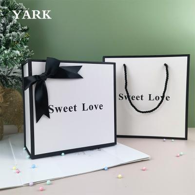 China Recycled Materials OEM Logo Luxury Magnetic Product Packaging Paper Custom Printing Clothes Magnetic Folding Gift Boxes With Ribbon Gift Boxes for sale