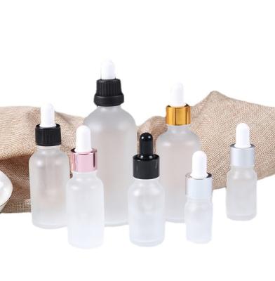 China 20ml 30ml 50ml cosmetic clear frosted soda lime glass bottle,plastic perfume and essential oil dropper bottle for sale