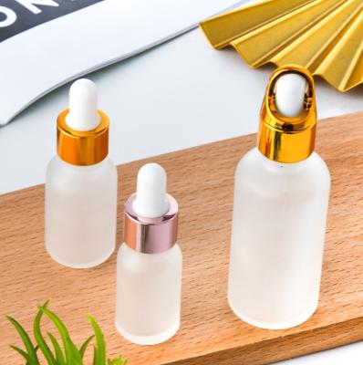 China 50ml Cosmetic Frosted Clear Glass Cosmetic Plastic Head Essential Oils Dropper Bottle for sale