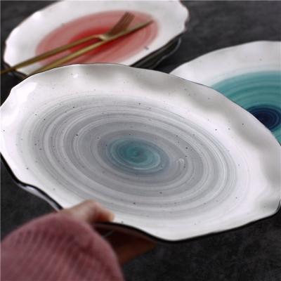 China Sustainable Gray Ceramic Pasta Ware Tableware Spiral Dish With Wave Edge for sale