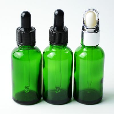 China 1Oz 30ml Personal Care Essential Oil Personal Care Cosmetic Green Glass Vessel Bottle for sale