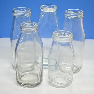 China 100ml 250ml Empty Clear Beverage Pudding Yogurt Juice Energy Drinks Glass Bottle for sale