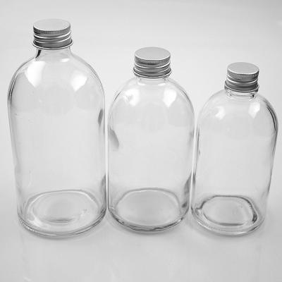 China Eco-friendly 270ml 350ml 500ml Round Clear Milk Juice Beverage Packaging Glass Bottle With Screw Metal Lid for sale