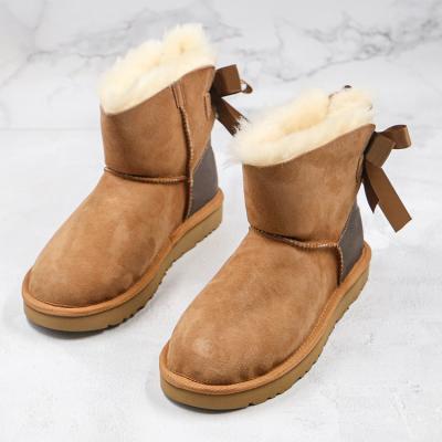 China 2021Wholesale Fashion Trend Fashion Womens Winter Snow Boots Real Wool One Snow Boots Womens Bow for sale