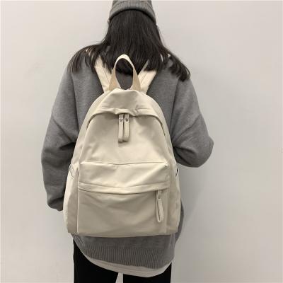 China Simple fashion multi-functional waterproof children's backpack youth canvas anti-theft school bag for sale