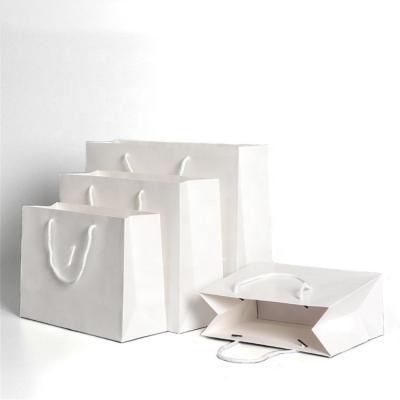 China Luxury Wedding White Cardboard Paper Gift Bag Custom Jewelry Printed Logo Paper Bag Recyclable Manufacturing With Cotton Rope Handle for sale