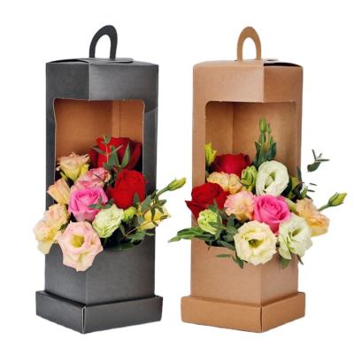 China Recycled Materials Wholesale Cavity Creative Window Design Bouquet Cardboard Flower Carrier Portable Gift Packaging Paper Bag for sale