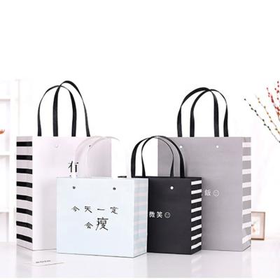 China Firm Luxury Paper Gift Bags Gray Custom Paper Gift Gift Paper Bag Luxury Shopping Packaging for sale