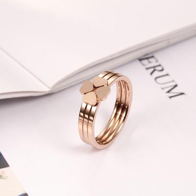 China Punk Gold Ring Jewelry Lucky Four Leaf Flower Rose Three-in-One Stainless Steel Women's Love Titanium Steel Ring Jewelry for sale