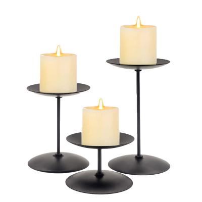 China Retro Christmas Home Candlestick Decoration Disc Black Metal Wrought Iron Tray Candle Base Matte Iron Column Candlestick for sale