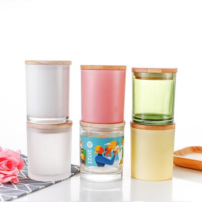 China Home Decoration Wholesale Empty Green/Solid Color Blue/Pink Woodland Glass Jars With Lids For Candles for sale