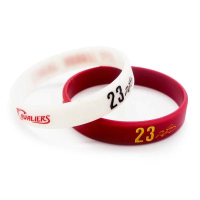 China Events Factory Customize Silicone Wristband Stamping Round Magnets Picture Relief Silicone Wristband for sale