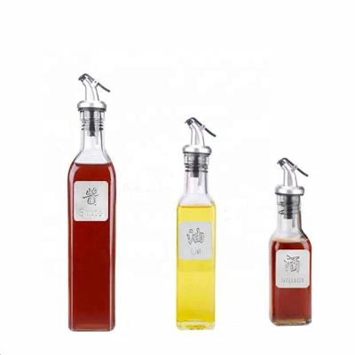 China Food 125ml 250ml 500ml Olive Oil Glass Bottle With Dispenser Kitchen Glass Vinegar Condiment Set With Airtight Spout for sale