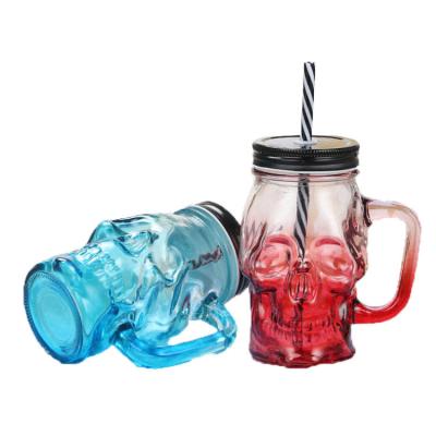 China Cover With Hole 450ml 16oz Skull Shape Glass Drinking Mason Jar With Handle And Lids for sale