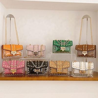 China 2023 Fashion Ladies Handbags PORTABLE Cross - Body Clear Jelly Purse Small Women' S Shoulder Chain Sling PVC Mini Bags for sale