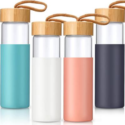 China Wholesale Borosilicate Glass Water Bottle Custom Viable Glass Water Bottle With Silicone And Bamboo Sleeve Lid for sale