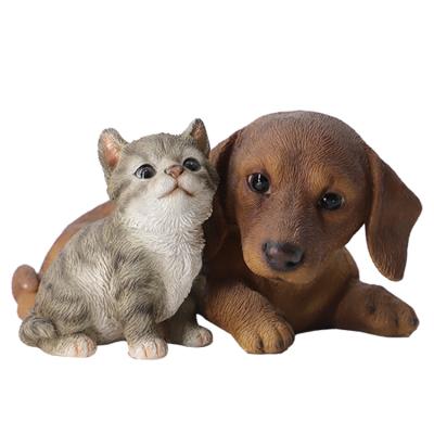 China Europe Polyresin Cat And Dog Small Resin Animal Figurines , Dachshund Figurines Dog Statues With Cat for sale