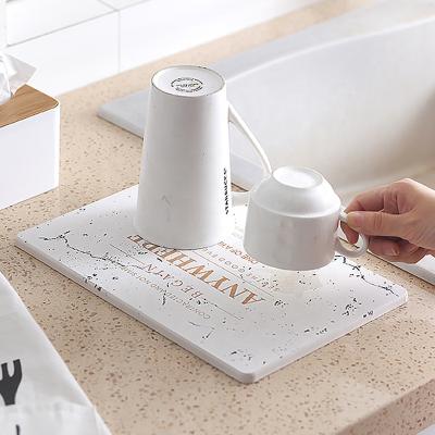 China New Fashionable Home Decor Dry Dish Rack Pad Absorbent Diatomite Kitchen Table Mat for sale