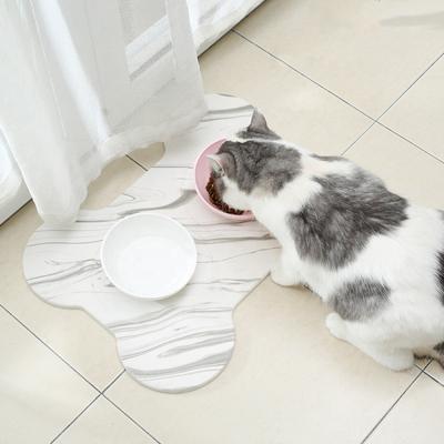 China New Design Sustainable Eco Friendly Water Absorbing Diatomite Bone Shape Pet Bowl Mat for sale