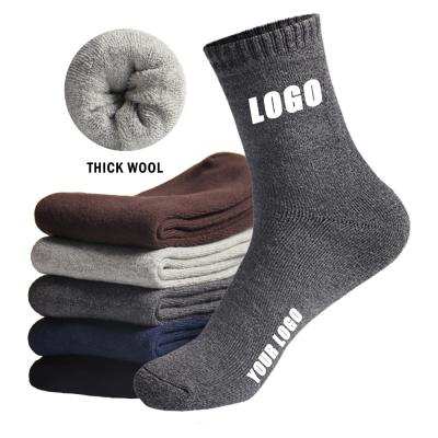 China Custom Logo Thick Wool Socks Men Winter QUICK DRY Warm Heavyweight Socks for Men Designer Wool Socks for sale