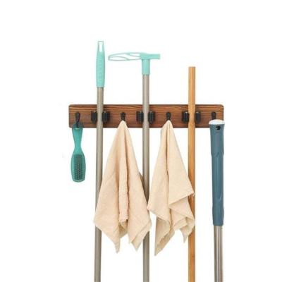 China Home Garage Garden CleaningTool Storage Metal Scalable Broom Holder Burned Wood Broom Holder Wall Mount for sale