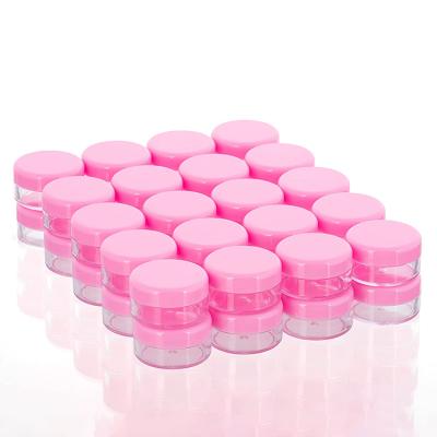 China 10g Portable High Quality Skin Care Cream Plastic Pink Cosmetic Packaging Jars Containers With Lids for sale