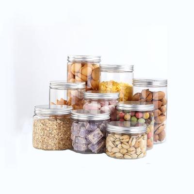 China Recycable Empty Clear Plastic PET Cookie Jar 700ml Package Plastic With Aluminum Metal Lids for sale