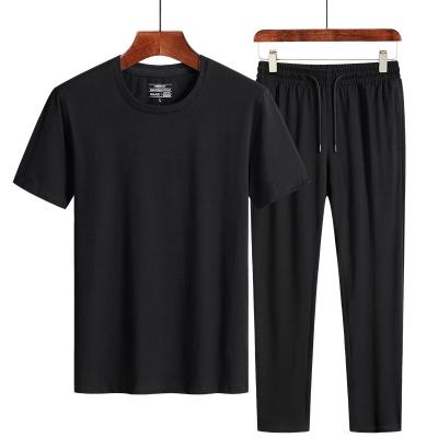 China 2021 New Spring/Summer QUICK DRY Men Round Collar Solid Color Shorts Sleeve Cotton Pieces Two T-shirt Pants Suit Plus Size Man's T-shirt for sale