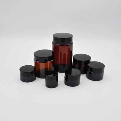 China High quality simple round shape cosmetic amber empty glass cosmetic jar with lid for sale