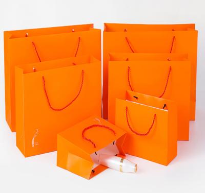 China Recyclable Richpack Shopping Bag and Paper Magic, Orange and Gold Paper Shopping Bag for sale