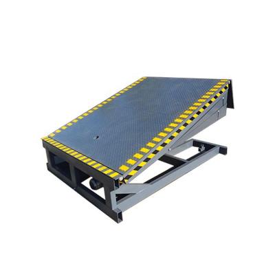 China Fixed Adjustable Yard Ramp Container Leveler Construction Material Stores 12t Warehouse Dock Hydraulic Ramp for sale