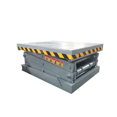 China Building Material Shops Hydraulic Electric Cargo Scissor Lift Table Stationary Scissor Dock Lift Platform with Lips for sale