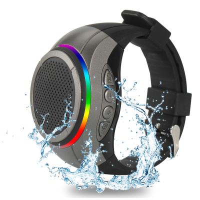 China Custom X10 Multimedia LED Flashing Light Mini Tooth Speaker Blue Logo Watch Shaped Digital Music Audio Speaker for sale