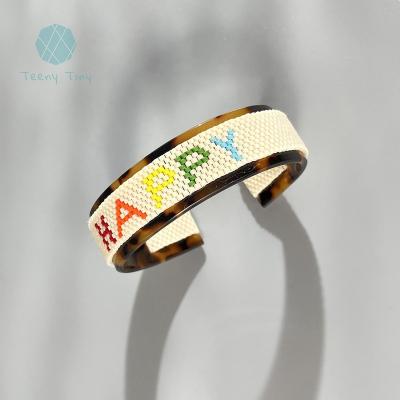 China Teenytiny FASHIONABLE 2022 New in Turtle Shell Acetate Open Cuff Bangle Embellished with Custom Rainbow Word Seed Bead for sale