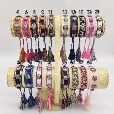 China BOHEMIA 42 Colors Fashion Handmade Women Men Friendship Metal Buckle Bangle Bracelet Rivet Braided Bracelet With Tassel for sale