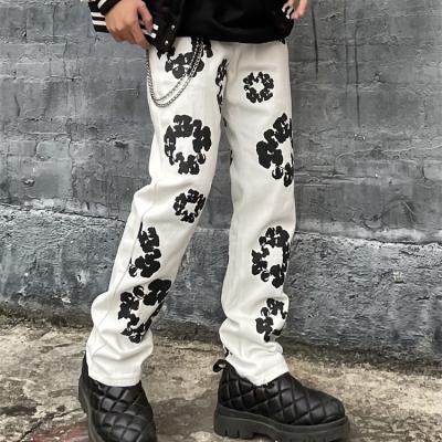 China Breathable European and American kapok flower printed brand new fashion straight jeans men's white pants for sale