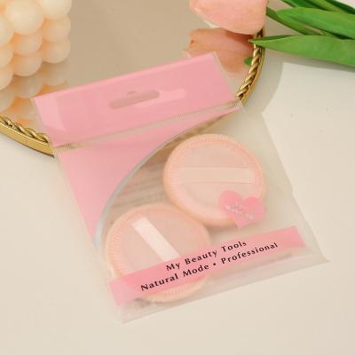 China Facial Cleansing Beauty Makeup Low MOQ Customized 2PCS Round Pressed Ribbon Puff Dry Powder Loose Powder Makeup Puff Facial Powder Makeup Puff for sale