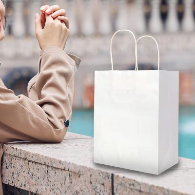 China New Design 100% Recycled Biodegradable White Paper Bags With Paper Rope / Flat Handle Custom Paper Bag for sale