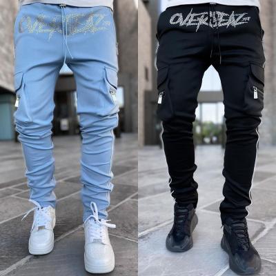 China Custom Logo Solid Color Slim Leggings Cargo Stretch Sweatpants Anti-Wrinkle Gym Pants Jogger Reflect Running Jogging Pants Man for sale