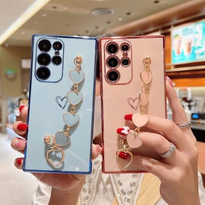 China High Quality Shockproof Plated Back Cover With Hollow Heart Strap Design Luxury Cell Phone Case For Samsung S23 ultra A14 for sale