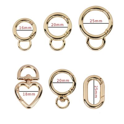 China Widely Applied Gold Wholesale Luxury Shiny Metal Spring Ring Buckles Round Shape Open Circular Snap Ring For Bag for sale