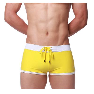 China Latest Breathable Mens Swimwear Boxer Shorts Low Waist Solid Color Man Swim Trunks for sale