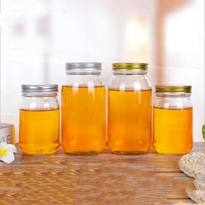 China Chemical Round Transparent Honey Glass Bottle Jar 500g 1000g Honey Glass Bottle for sale