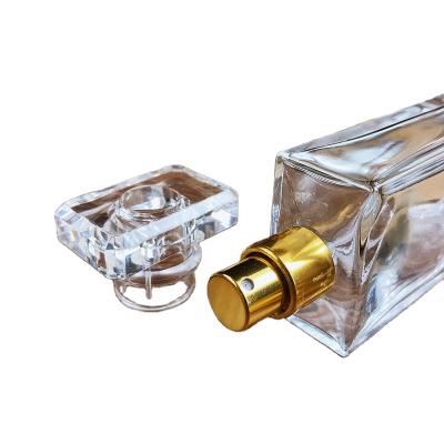 China Square Gift Clear 30ml 100ml 50ml Glass Perfume Bottle With Spray Gold And Sliver Cap for sale