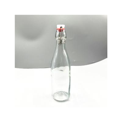 China Wholesale China Manufacturer Stocked Round Olive Glass Empty Oil Bottle for sale